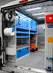 02_The left of the Ducato with enclosed shelves and a stainless-steel tray for jerry cans