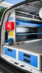 02_The pull-out vice bench, case compartment, shelf and transparent containers on the left of the Fiat Doblò