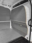 44_The van’s bulkhead covered in marble-look plywood
