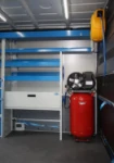 A compressor- generator in a Syncro upfit inside an agricultural mechanic’s van