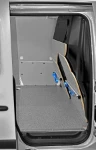A marble-look plywood bulkhead liner in the Nissan NV250