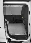 A plywood floor liner and steel sheet wall liners in a Berlingo