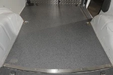 A plywood floor liner with the new marble-look coating