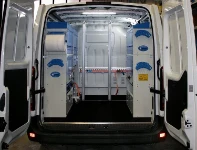 A Renault Master with an upfit for servicing sheet metal processing machines