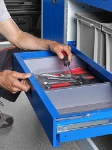 A Syncro Ultra drawer with a recessed release button and internal space dividers