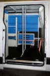 Cargo bars in a light commercial belonging to a company that installs sheet metal forming machines