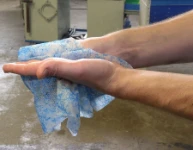 Cleaning hands with Scrubs wipes