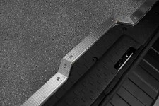 Non-slip edge protectors for plywood floor liners