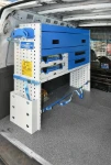 02_A racking system with a case compartment, drawers, shelves and accessories in an old van