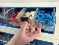 03_A transparent container for vans showing its release button