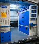 03_The transparent containers and pull-out vice bench on the right of the Trafic