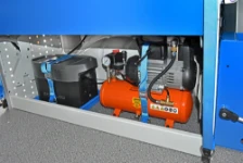 04_A floor-level compartment in the Transporter containing an Ecoflow unit and a compressor