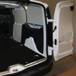 A bar and strap lashing system in a cable installer’s mobile workshop