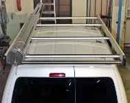 A Caddy roof rack with a pipe carrier