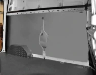 A marble-look plywood floor liner and sheet steel bodywork liners in a Talento