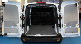 A non-slip, marble-look plywood floor liner in a 2013 Ford Connect
