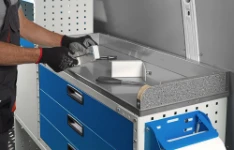 A plywood work bench with a super-strong stainless-steel cover