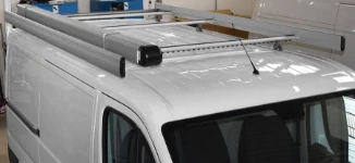 A roof rack and pipe carrier on a Ducato