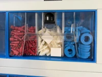 A transparent container divided into three compartments