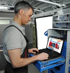 A van racking system with a computer stand