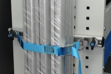 Cargo secured with a bar and strap system