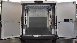 Non-slip floor and bulkhead liners in marble-look plywood and interior liners in a Citroen Jumper