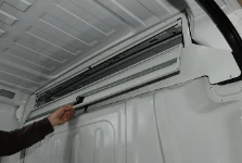 Opening of van cab storage unit