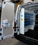 Racking and accessories in a van used to carry and repair compressors