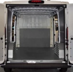 The Peugeot Boxer’s load compartment fitted with a floor liner and wall lining panels