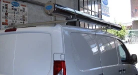 Roof bars with a pipe carrier on a Scudo
