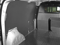 The floor, bulkhead, and wall liners on the left of the NV250