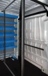Vertical cargo bars for securing doors and windows in a van